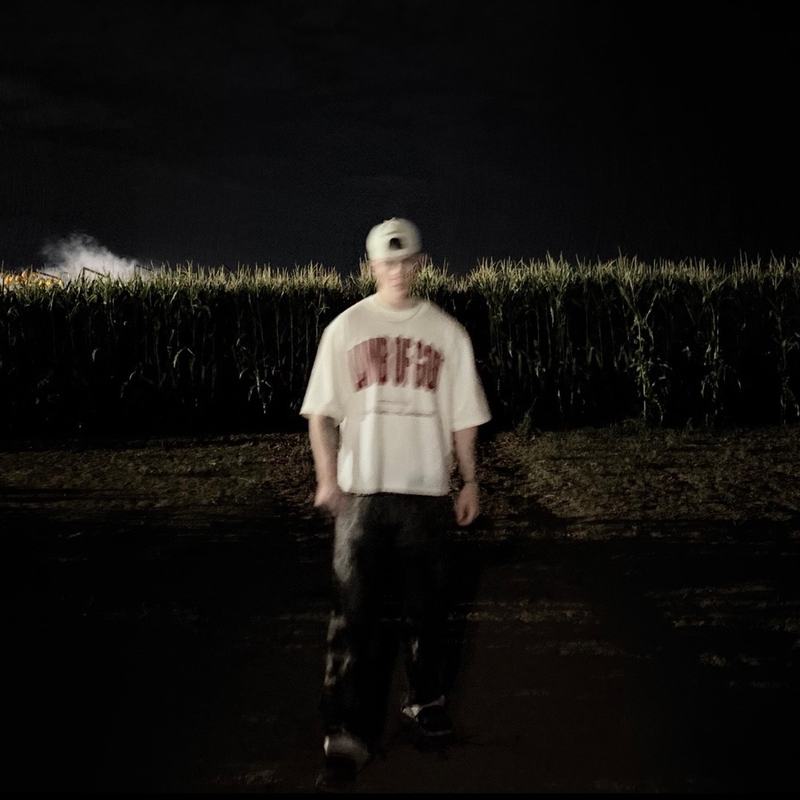 REIGN! cover, Wy at the edge of a cornfield at night